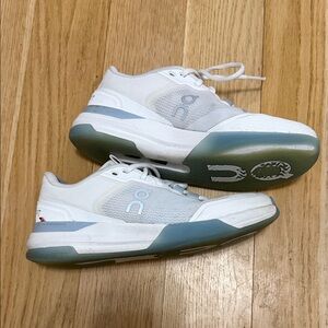 On cloud blue and white tennis shoes